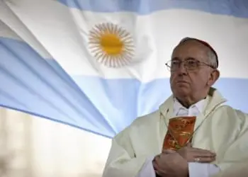 FILE - In this Aug. 7, 2009 file photo, Argentina's Cardinal Jorge Bergoglio gives a Mass outside the San Cayetano church where an Argentine flag hangs behind in Buenos Aires, Argentina. On Wednesday, March 13, 2013, Bergoglio was elected pope, the first ever from the Americas and the first from outside Europe in more than a millennium. He chose the name Pope Francis. (AP Photo/Natacha Pisarenko)