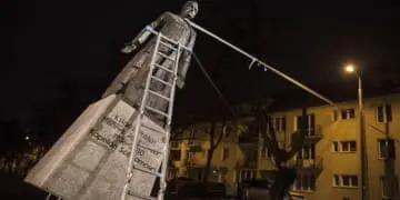 Activists in Poland pull down a statue of a prominent deceased priest, Father Henryk Jankowski, who allegedly abused minors sexually, in Gdansk, Poland, on Thursday Feb. 21, 2019. The activists said it was an act of protest against the Polish Catholic Church for failing in resolving the problem of clergy sex abuse. The protest comes as Pope Francis has gathered church leaders from around the world at the Vatican to grapple with the church's sex abuse crisis. (AP Photo/Bartek Sabela/Gazeta Wyborcza)