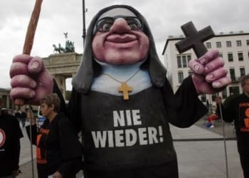 A giant nun puppet is seen in front of the Brandenburg Gate during a demonstration of German abuse victims and activists against sexual abuse in the catholic church in Berlin to protest against the visit of German-born Pope Benedict XVI on September 22, 2011, the first day of the Pontiff's first state visit to his native Germany. The 84-year old pope, German born Joseph Ratzinger, has a packed program, with 18 sermons and speeches planned for his four-day tri p to Berlin, Erfurt in the ex-German Democratic Republic and Freiburg. AFP PHOTO / MICHELE TANTUSSI