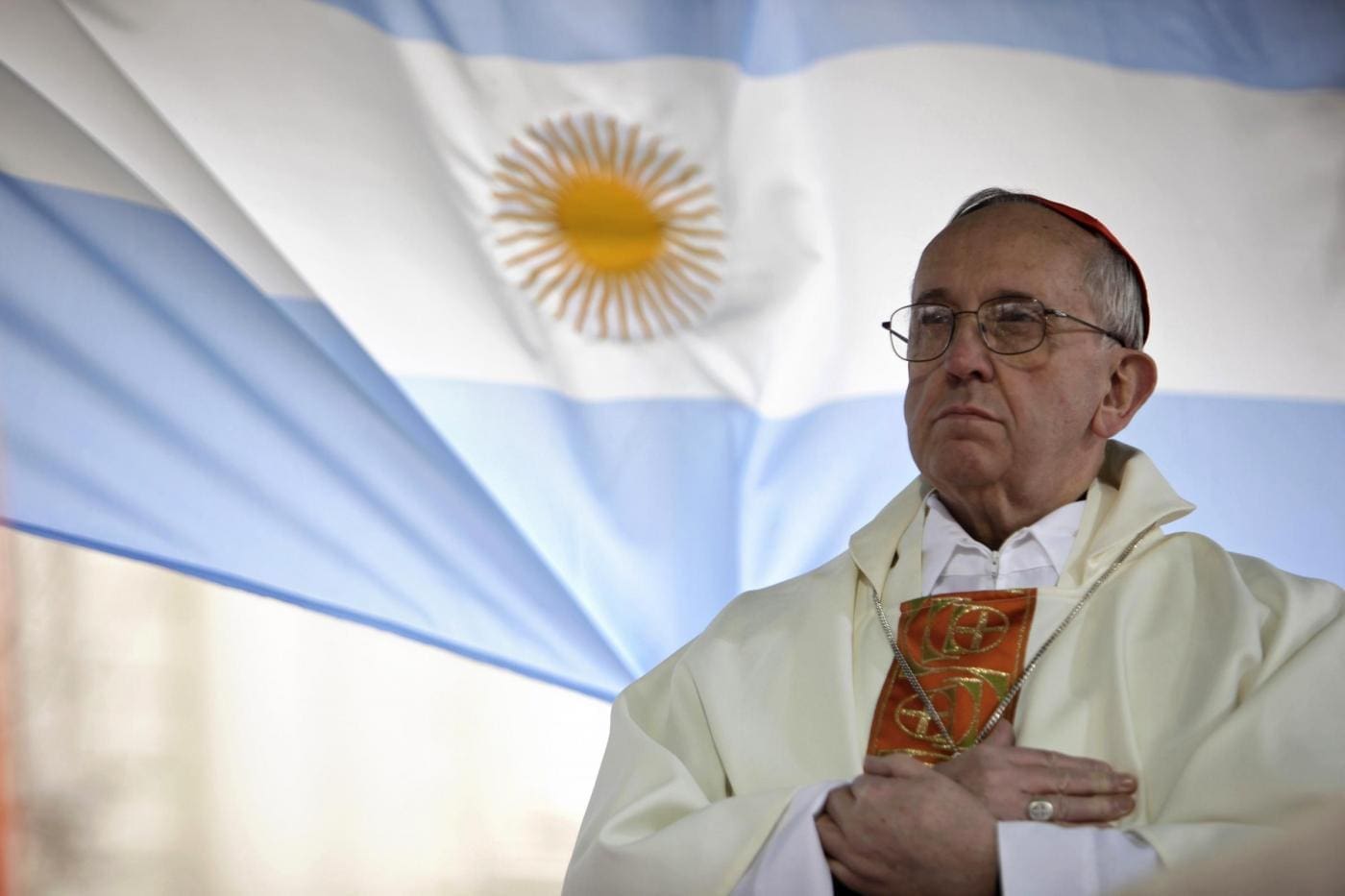 FILE - In this Aug. 7, 2009 file photo, Argentina's Cardinal Jorge Bergoglio gives a Mass outside the San Cayetano church where an Argentine flag hangs behind in Buenos Aires, Argentina. On Wednesday, March 13, 2013, Bergoglio was elected pope, the first ever from the Americas and the first from outside Europe in more than a millennium. He chose the name Pope Francis. (AP Photo/Natacha Pisarenko)