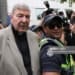 A police officer makes way for Cardinal George Pell as he leaves the County Court of Victoria court after prosecutors decided not to proceed with a second trial on alleged historical child sexual offences in Melbourne on February 26, 2019. - Australian Cardinal George Pell, who helped elect popes and ran the Vatican's finances, has been found guilty of sexually assaulting two choirboys, becoming the most senior Catholic cleric ever convicted of child sex crimes. (Photo by Asanka Brendon Ratnayake / AFP)        (Photo credit should read ASANKA BRENDON RATNAYAKE/AFP/Getty Images)