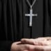 A priest attends a Good Friday procession in Lohr, southern Germany April 2, 2010. REUTERS/Johannes Eisele (GERMANY - Tags: RELIGION SOCIETY)