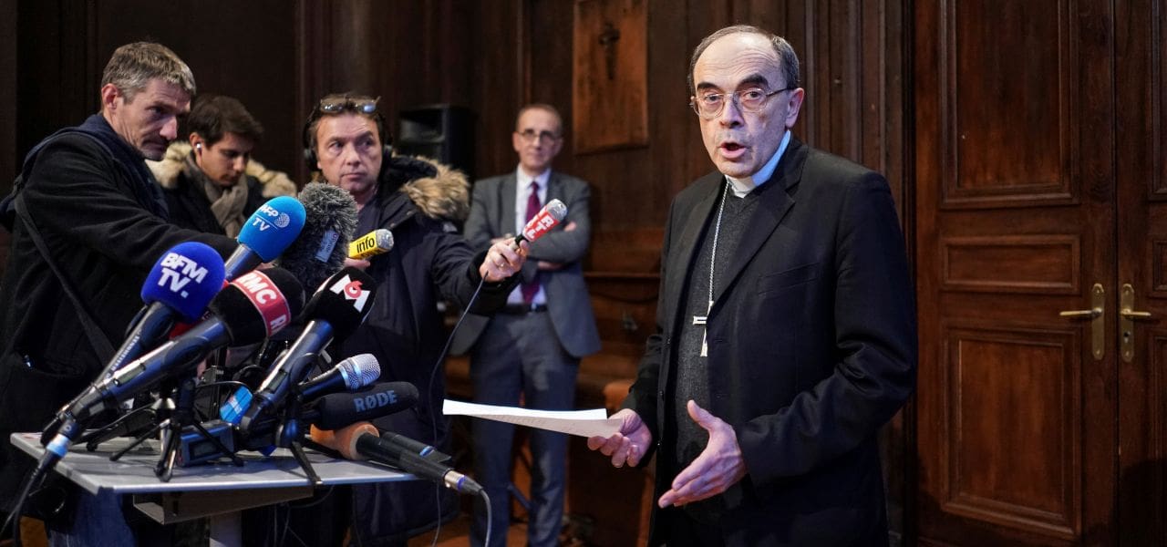 Cardinal Philippe Barbarin speaks during a press conference in Lyon, central France, after a French appeals court acquitted him of covering up the sexual abuse of minors in his flock, Thursday, Jan.30, 2020. (AP Photo/Laurent Cirpriani)