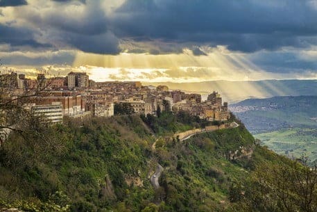 the sun breaking through the clouds above Enna - the highest city in Sicily